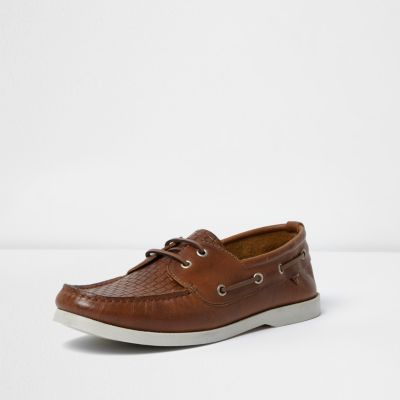 Tan woven boat shoes